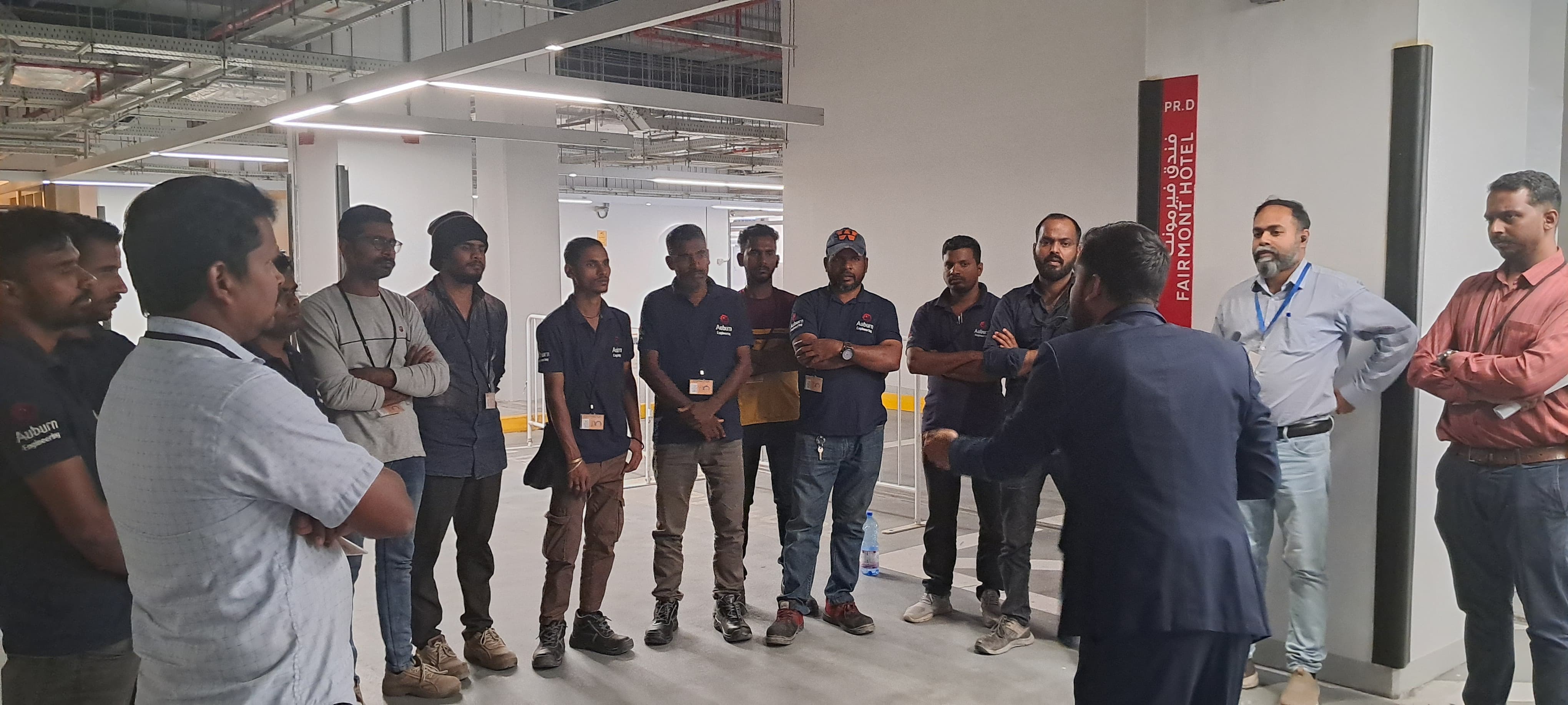 A site manager briefs the crew at a Fairmont Hotel project — hospitality-sector ACMV works.